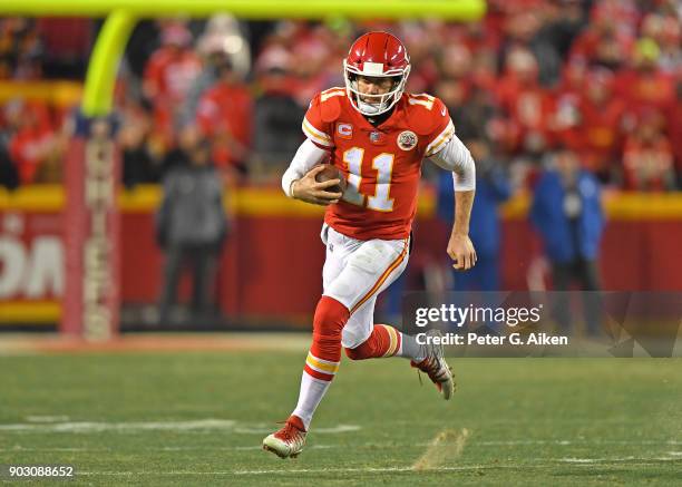 Quarterback Alex Smith of the Kansas City Chiefs runs up field during the second half of the game against the Tennessee Titans at Arrowhead Stadium...