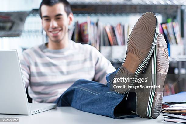 man with feet on desk - sole of shoe stock pictures, royalty-free photos & images