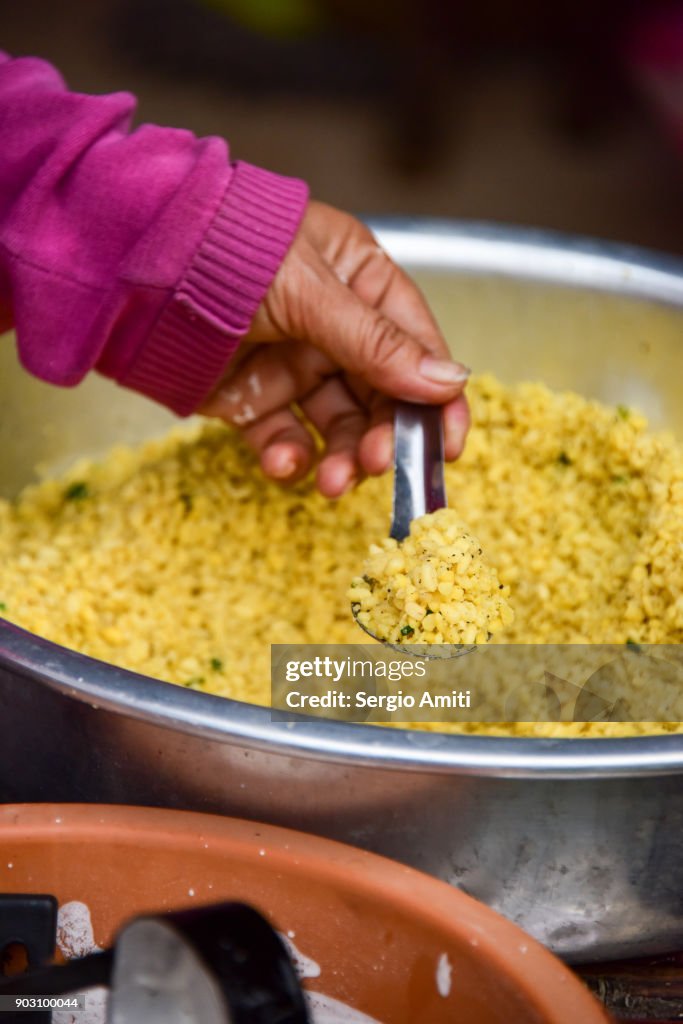 Preparing Laos savoury rice coconut cakes