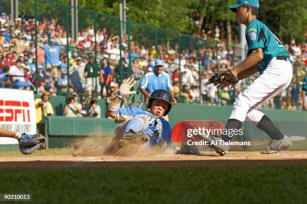 Little League World Series: US Team West Nick Conlin in action, scoring game tying run on wild pitch vs Asia Pacific Hung Yuan Lin during 4th inning...