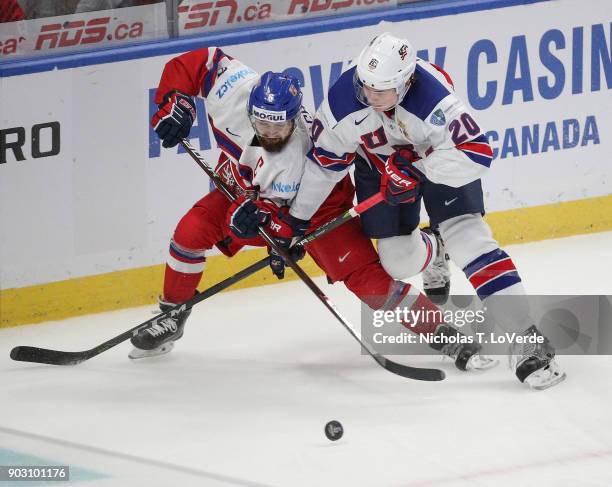 Marek Zachar of Czech Republic battles with Andrew Peeke of United States during the second period of play in the IIHF World Junior Championships...