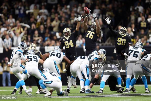 Tony McDaniel of the New Orleans Saints attempts to block the field goal of Graham Gano the Carolina Panthers during the first half of the NFC Wild...
