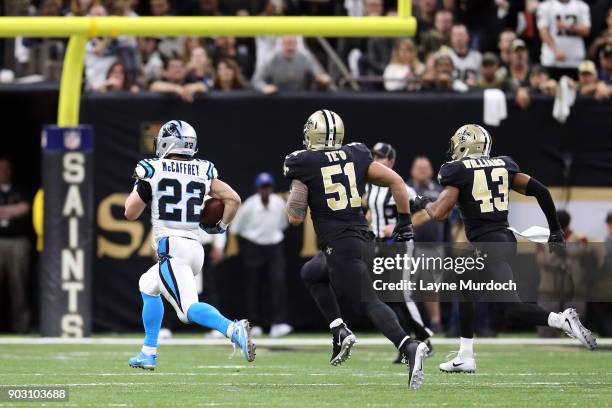 Christian McCaffrey of the Carolina Panthers runs for a touchdown against Manti Te'o and Marcus Williams of the New Orleans Saints during the second...