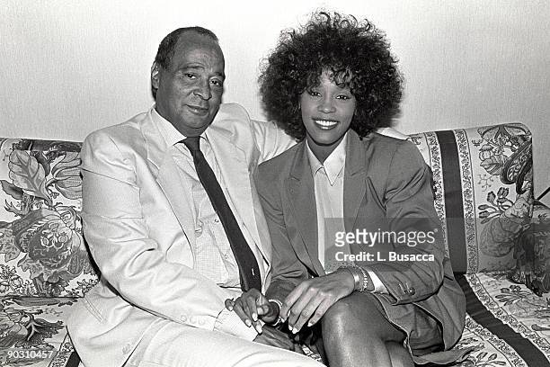 Businessman John Houston and his daughter, American vocalist Whitney Houston, pose for photographs, New York, New York, 1989.