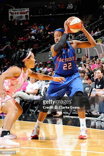 Alexis Hornbuckle of the Detroit Shock looks to pass over Helen Darling of the San Antonio Silver Stars during the WNBA game on August 29, 2009 at...