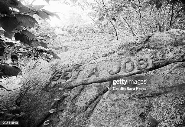 get a job carved on rock - sara stone fotografías e imágenes de stock