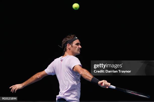 Roger Federer of Switzerland plays a backhand during a practice session ahead of the 2018 Australian Open at Melbourne Park on January 10, 2018 in...
