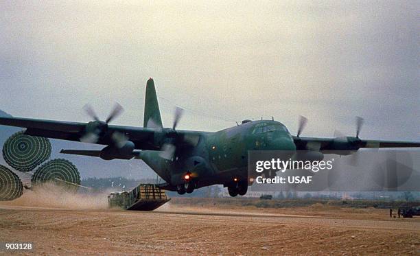 Hercules aircraft makes a Low-Altitude Parachute Extraction System supply drop at Jo Ju Air Strip during the joint Korean/U.S. Exercise Team Spirit...