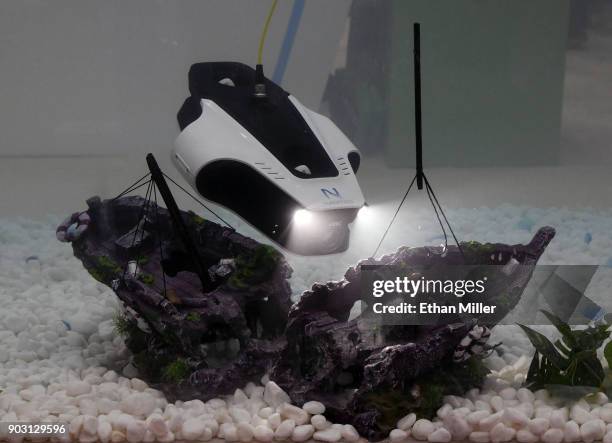 The Mito underwater robot by Navatics is demonstrated in a tank of water during CES 2018 at the Sands Expo and Convention Center on January 9, 2018...