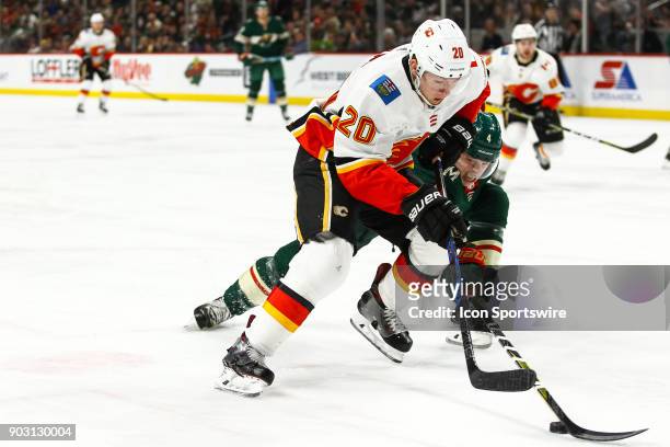 Calgary Flames right wing Curtis Lazar in action while Minnesota Wild defenseman Mike Reilly defends in the 2nd period during the Western Conference...