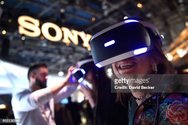 Attendee Kristen Sarah uses Sony's Playstation VR at the Sony booth during CES 2018 at the Las Vegas Convention Center on January 9, 2018 in Las...