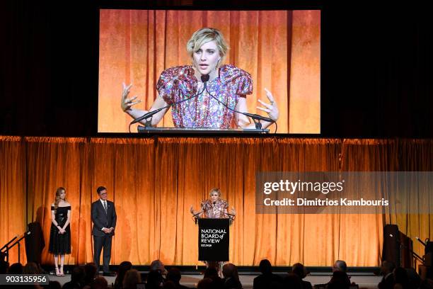 Greta Gerwig accepts an award onstage with Stephen Colbert during the National Board of Review Annual Awards Gala at Cipriani 42nd Street on January...