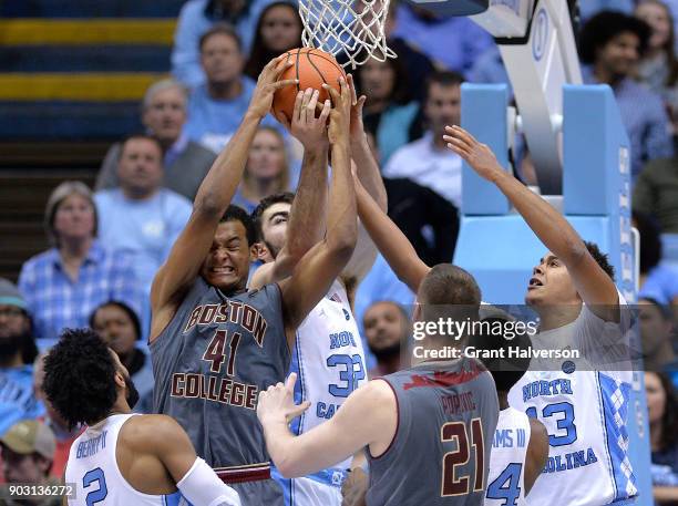Steffon Mitchell of the Boston College Eagles batles Luke Maye of the North Carolina Tar Heels for a rebound during their game at the Dean Smith...