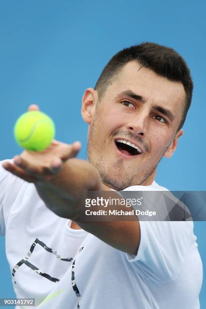 Bernard Tomic of Australia serves during a practice session ahead of the 2018 Australian Open at Melbourne Park on January 10, 2018 in Melbourne,...