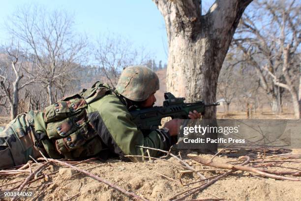 Police officer on the target site during the encounter with the rebels. There were two rebels & a civilian have been killed at Larnoo area of...