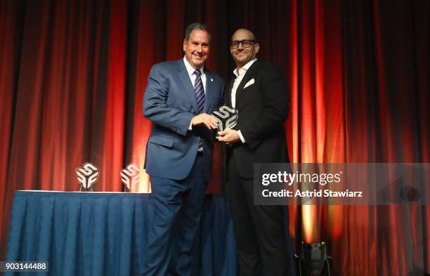Honoree, Former Chairman & CEO of Saks, Inc. Stephen Sadove accepts his award from Presenter, President of Saks Fifth Avenue, Inc. Marc Metrick...