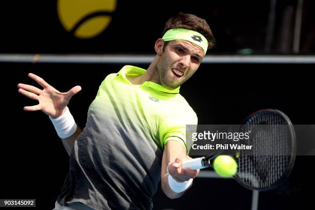 Jiri Vesely of the Czech Republic plays a backahand in his second round match against Sam Querrey of the USA on day three of the ASB Men's Classic at...