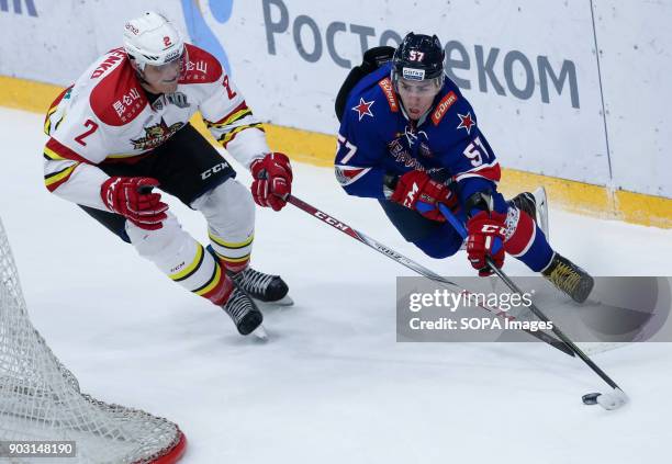 Roman Graborenko of HC Kunlun Red Star and Yegor Rykov of HC SKA Saint Petersburg in action during the 2017/18 Kontinental Hockey League Regular...
