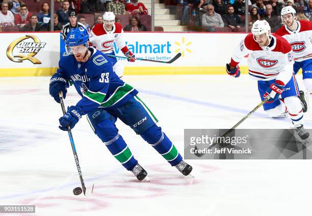 Andrew Shaw of the Montreal Canadiens skates after Henrik Sedin of the Vancouver Canucks during their NHL game at Rogers Arena December 19, 2017 in...