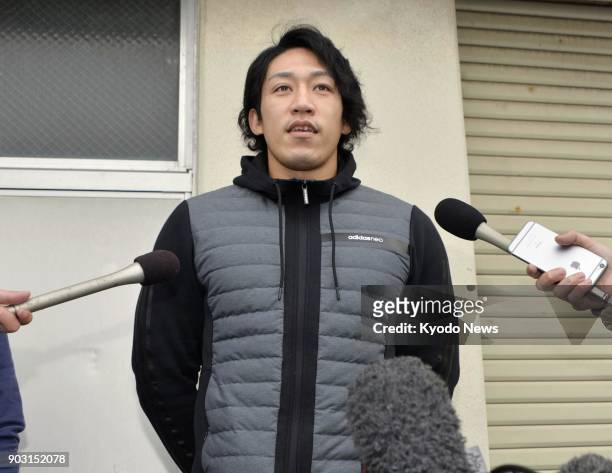 Japanese sprint canoeist Seiji Komatsu speaks to reporters in Komatsu, Ishikawa Prefecture, on Jan. 10, 2018. Komatsu failed a doping test after...