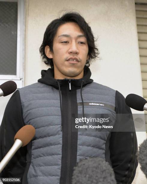 Japanese sprint canoeist Seiji Komatsu speaks to reporters in Komatsu, Ishikawa Prefecture, on Jan. 10, 2018. Komatsu failed a doping test after...