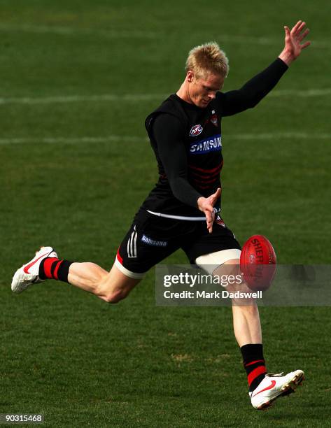 Adam McPhee of the Bombers kicks for goal during an Essendon Bombers AFL training session at Windy Hill on September 3, 2009 in Melbourne, Australia.