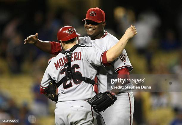 Closer Juan Gutierrez of the Arizona Diamondbacks celebrates with catcher Miguel Montero after getting the last out and the save against the Los...