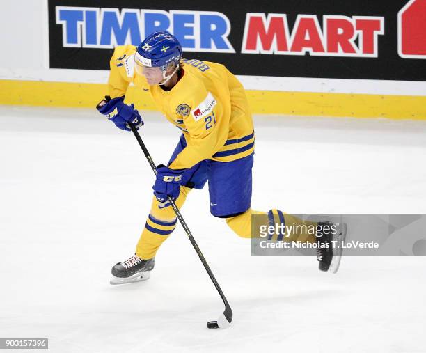 Jesper Boqvist of Sweden shoots the puck against the United States during the first period of play in the IIHF World Junior Championships Semifinal...