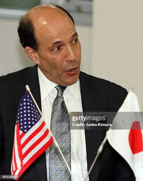 Ambassador to Japan John Roos talks to the Democratic Party of Japan President Yukio Hatoyama during their meeting at the DPJ headquarters on...