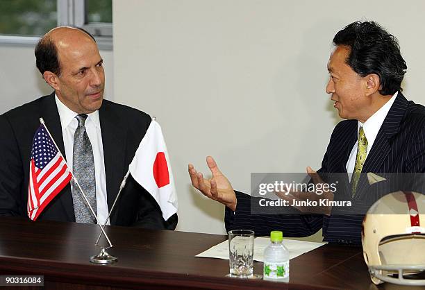 The Democratic Party of Japan President Yukio Hatoyama and U.S. Ambassador to Japan John Roos talk during their meeting at the DPJ headquarters on...