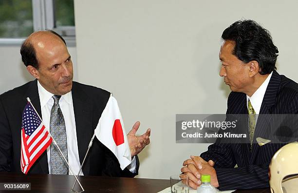 The Democratic Party of Japan President Yukio Hatoyama and U.S. Ambassador to Japan John Roos talk during their meeting at the DPJ headquarters on...