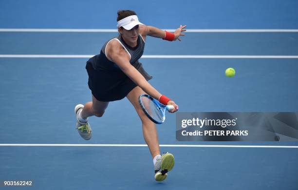 Garbiñe Muguruza of Spain hits a return to Kiki Bertens of the Netherlands in their women's singles second round match at the Sydney International...