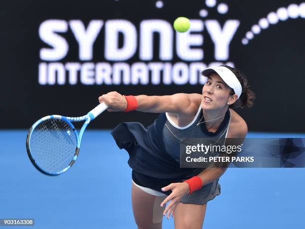 Garbiñe Muguruza of Spain hits a return to Kiki Bertens of the Netherlands in their women's singles second round match at the Sydney International...