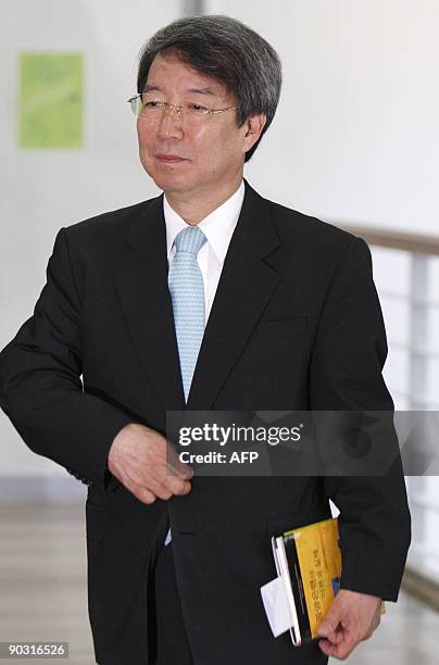 Chung Un-Chan, a professor of Seoul National University and former head of the university, walks into a classroom at the university in Seoul on...