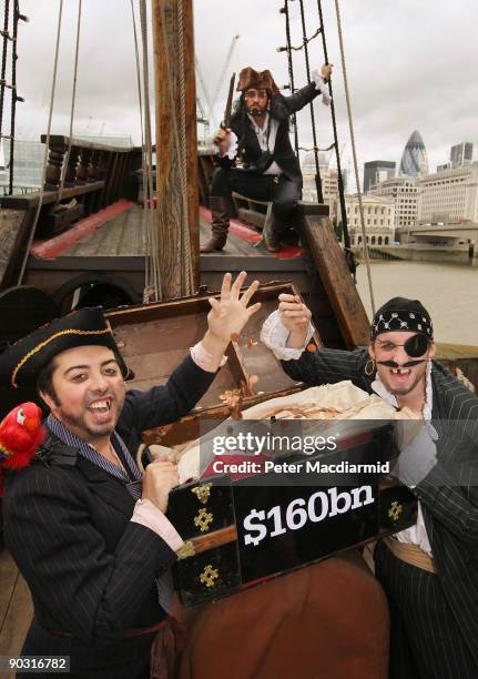 People dressed as pirates protest for the Christian Aid charity against tax avoidance on the Golden Hind ship on September 3, 2009 in London,...