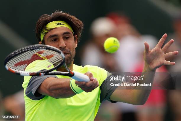 Marcos Baghdatis of Cyprus plays a forehand against Kevin Anderson of South Africa in the 2018 Kooyong Classic at Kooyong on January 10, 2018 in...