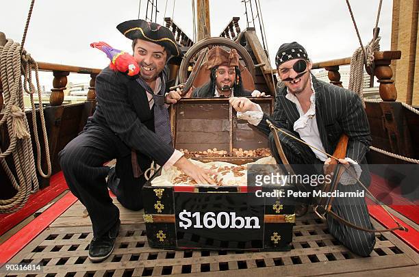 People dressed as pirates protest for the Christian Aid charity against tax avoidance on the Golden Hind ship on September 3, 2009 in London,...