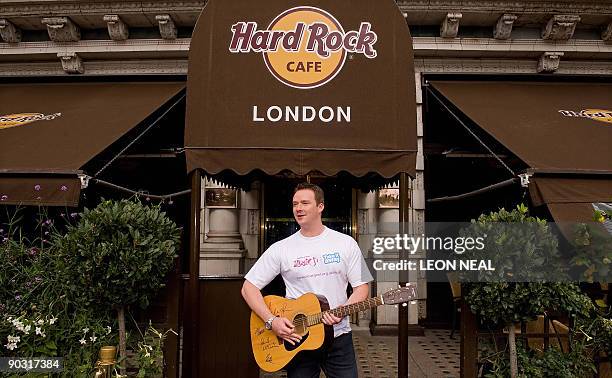 Opera singer Russell Watson attends a photocall at the Hard Rock Cafe in central London, on September 3, 2009 to promote a partnership between...