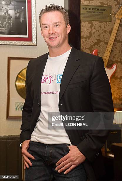 Opera singer Russell Watson attends a photocall at the Hard Rock Cafe in central London, on September 3, 2009 to promote a partnership between...