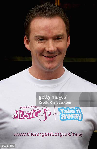 Opera Singer and former cancer sufferer Russell Watson poses for a photograph at a photocall to launch Practice-A-Thon at the Hard Rock Cafe on...