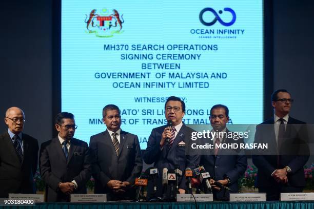 Malaysia's Transport Minister Liow Tiong Lai speaks during a press conference as Director general of Malaysia's Civil Aviation Department Azharuddin...