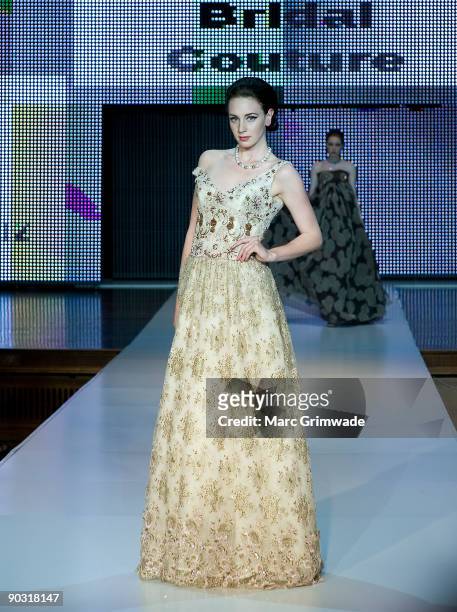 Model showcases designs by Darb Bridal Couture on the catwalk at the Mercedes-Benz Group Show 5 show as part of Mercedes-Benz Fashion Festival...