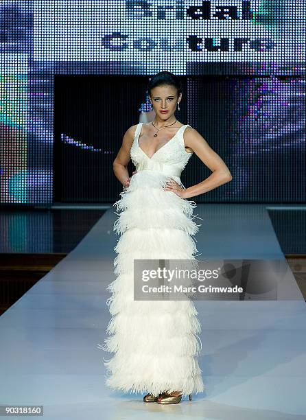 Model showcases designs by Darb Bridal Couture on the catwalk at the Mercedes-Benz Group Show 5 show as part of Mercedes-Benz Fashion Festival...