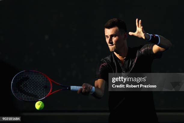 Bernard Tomic of Australia competes in his first round match against Vincent Millot of France during 2018 Australian Open Qualifying at Melbourne...