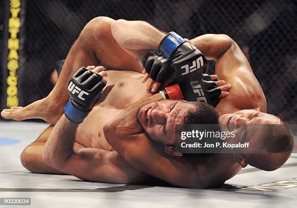 Fighter BJ Penn chokes out UFC fighter Kenny Florian during their Lightweight Championship fight at UFC 101: Declaration at the Wachovia Center on...