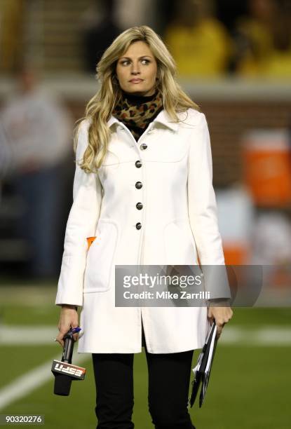Sideline reporter Erin Andrews walks across the field during pre-game warmups before the game between the Georgia Tech Yellow Jackets and the Miami...