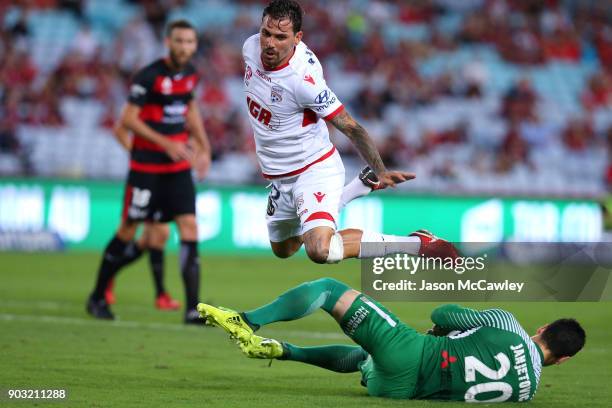 Ersan Gulum of Adelaide and Vedran Janjetovic of the Wanderers compete for the ball during the round 15 A-League match between the Western Sydney...