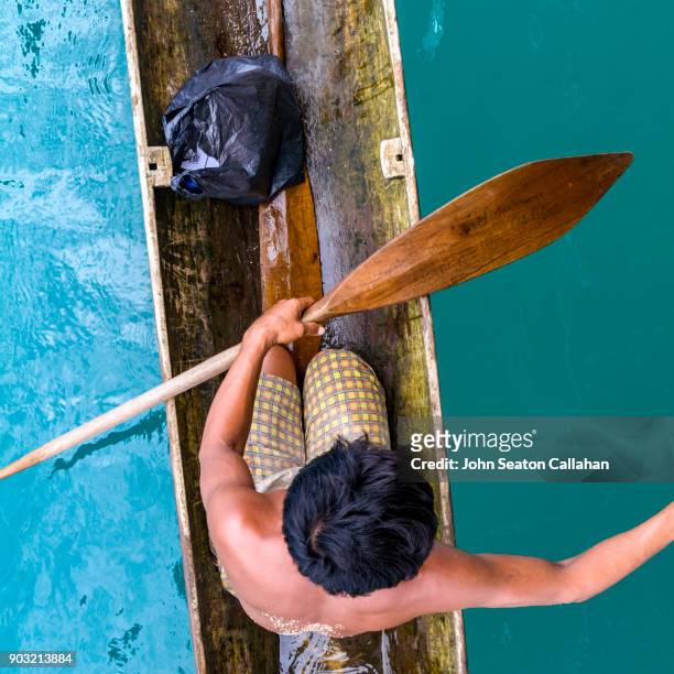 man in a canoe in the mentawai islands - indonesia mentawai canoe stock pictures, royalty-free photos & images