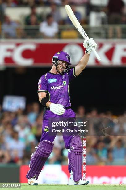 Arcy Short of the Hurricanes celebrates his century during the Big Bash League match between the Brisbane Heat and the Hobart Hurricanes at The Gabba...