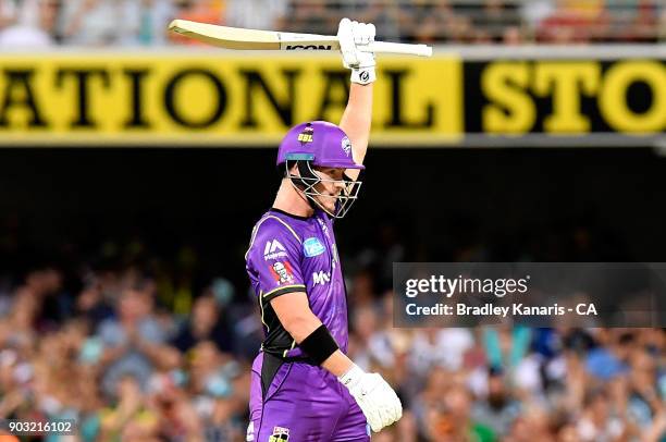 Arcy Short of the Hurricanes celebrates after scoring a century during the Big Bash League match between the Brisbane Heat and the Hobart Hurricanes...